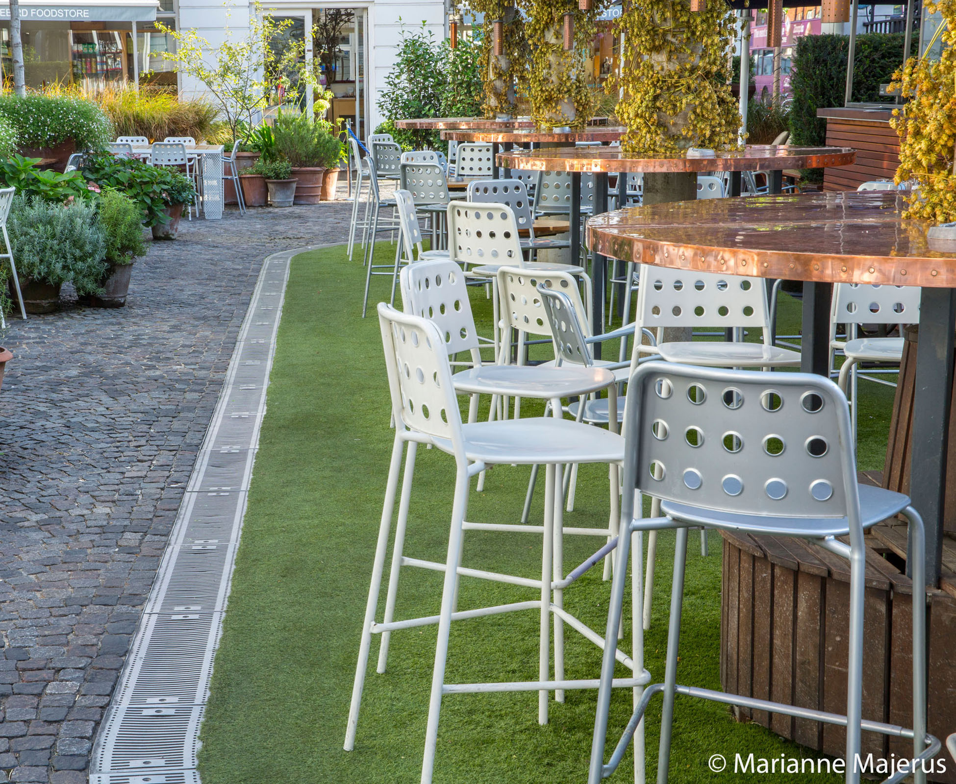 The high chairs and copper tables, designed by London Garden Designer, are perfect to grab a drink before heading to the Bluebird restaurant. 