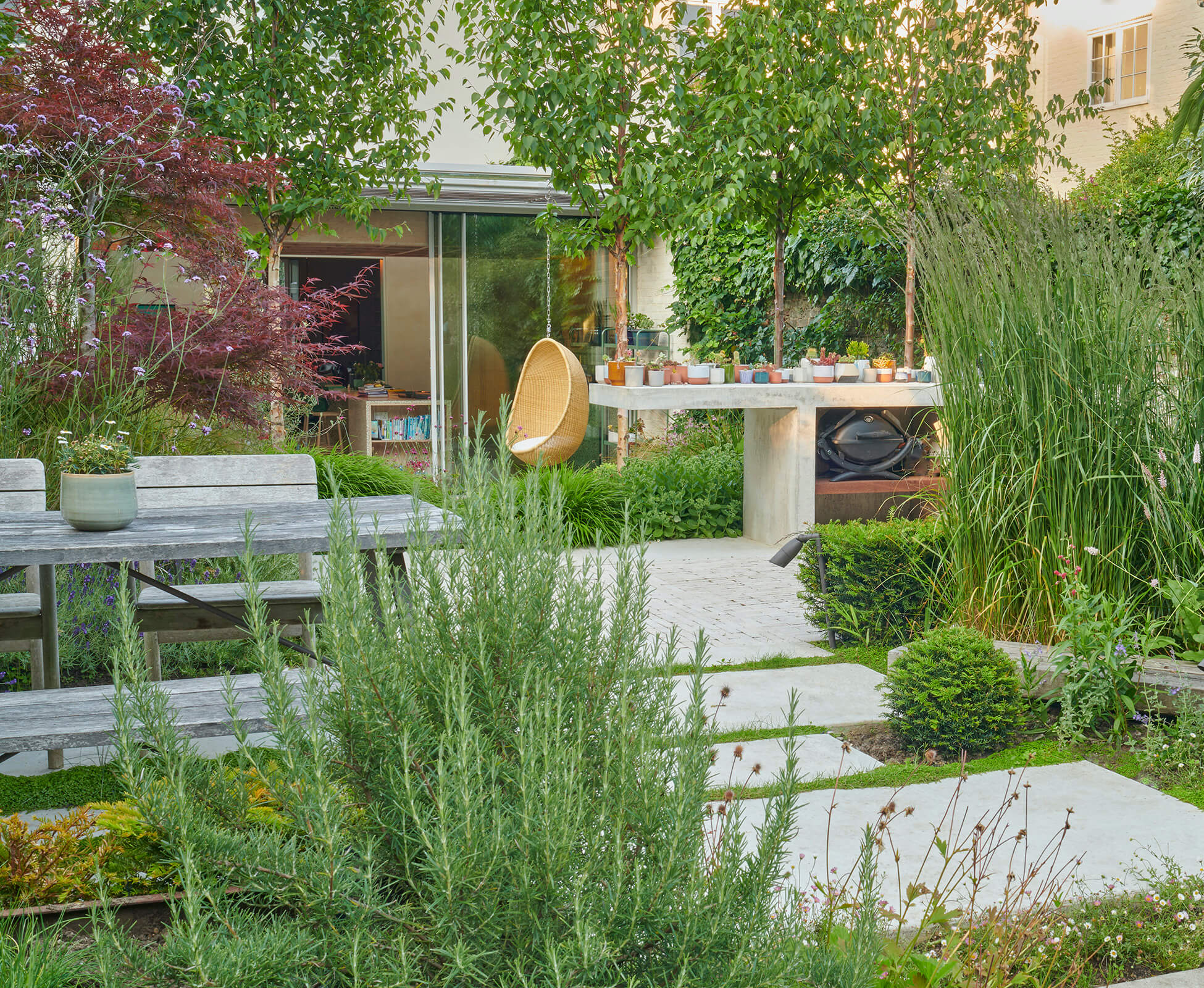 Overview of the rear garden, showing how the layout, planting, and design features work together to make the space both functional and special for the client.