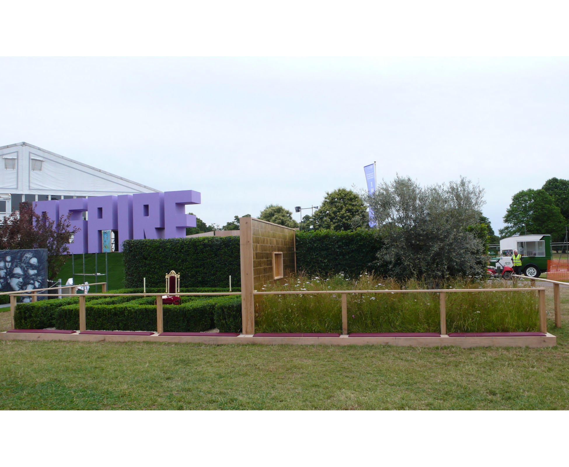 This conceptual garden designed on the theme of the seven deadly sins, expresses Greed at Hampton Court Palace Show Garden. Overview of the whole space allocated, showing both sides and both concepts by London Garden Designer.