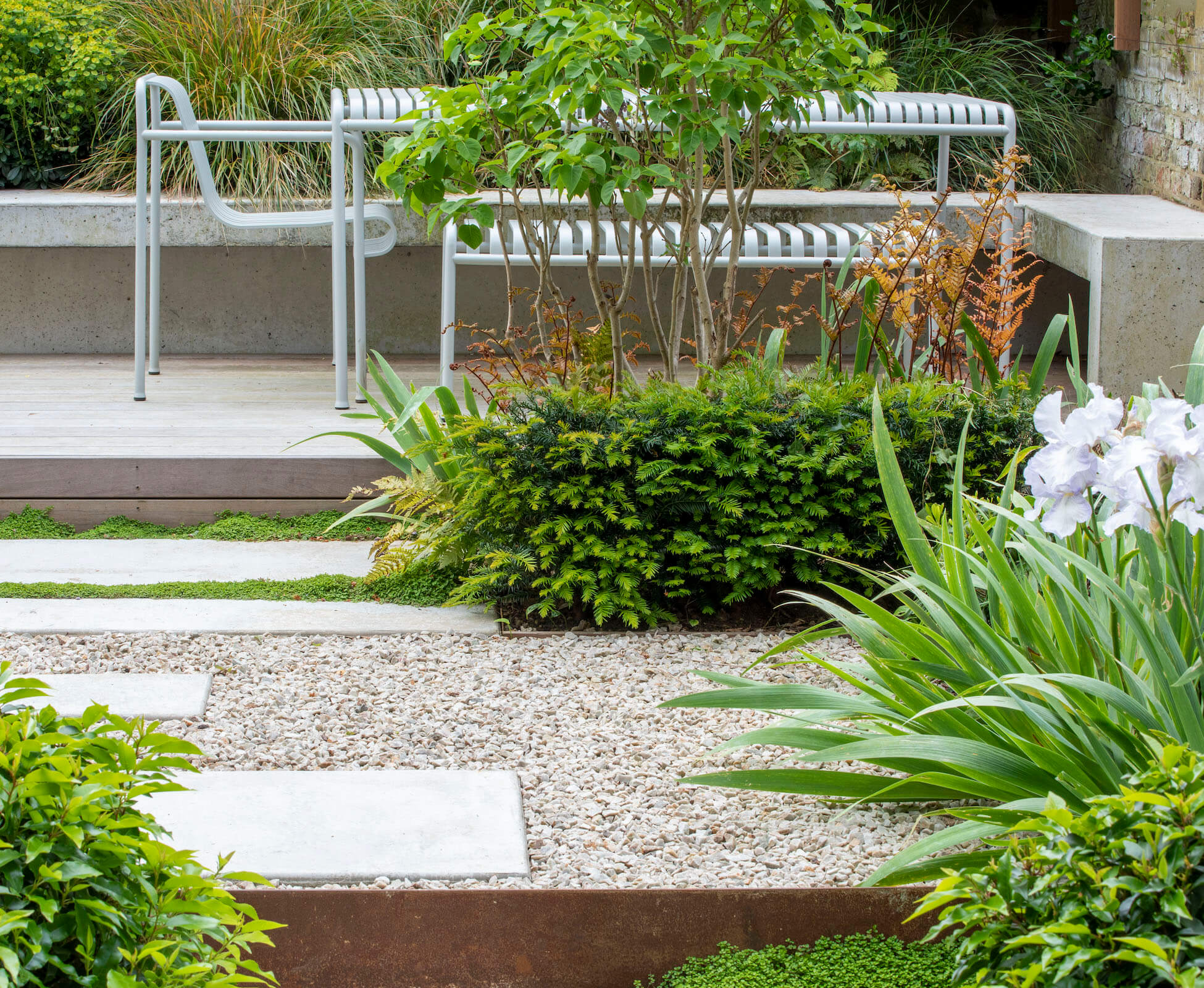 The layering of the structural planting in this garden and the simple foliage colour palette was key to its success.