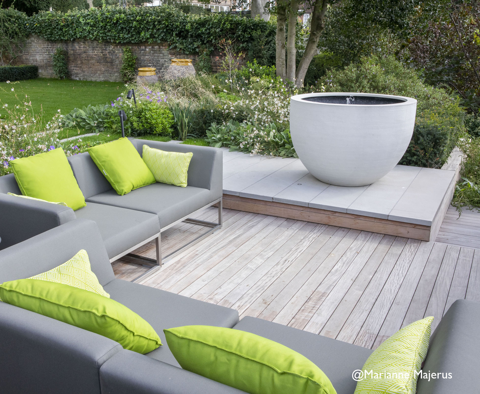 Cantilevered deck next to the water feature that provides an outdoor lounge area to capture the setting sun over the Hampstead horizon.